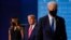 First lady Melania Trump and President Donald Trump, center, remain on stage as Democratic presidential candidate former Vice President Joe Biden walks away at the end of the final presidential debate Thursday, Oct. 22, 2020, in Nashville, Tenn.