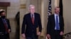 Senate Minority Leader Mitch McConnell, R-Ky., joined by Robert Duncan, the secretary for the minority, walks to the chamber as the Senate works to advance the $1 trillion bipartisan infrastructure bill, at the Capitol in Washington, Aug. 2, 2021
