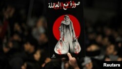 People hold a protest in support of Palestinians in Gaza, amid the ongoing conflict between Israel and the Palestinian Islamist group Hamas, in Amman