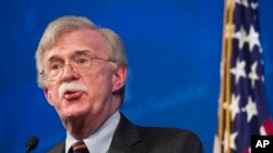 FILE - National Security Advisor John Bolton unveils the Trump Administration's Africa Strategy at the Heritage Foundation in Washington, Dec. 13, 2018. 