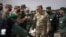 Gen. Stephen J. Townsend, head of the U.S. Africa Command, center, arrives alongside General Belkhir el-Farouk, right, Moroccan Southern Zone Commander, to watch a large scale drill as part of the African Lion military exercise, June 18, 2021.