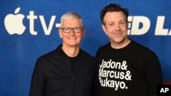 Tim Cook, left, and Jason Sudeikis arrive at the premiere of the second season of "Ted Lasso" on July 15, 2021, at the Pacific Design Center. 