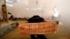 A protester holds a banner during a demonstration in Mong Kok district in Hong Kong, China.
