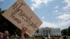 Demonstrators gather outside the White House in support of an investigation of Donald Trump, May 10, 2017.