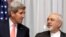 FILE - U.S. Secretary of State John Kerry, left, listens to Iran's Foreign Minister Mohammad Javad Zarif, right, March 16, 2015 in Lausanne, Switzerland.