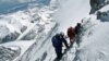 FILE - A team of mountaineers is seen climbing Mount Everest.