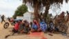 FILE - A group of women take shelter under a tree a the Bogo IDP camp in Maroua, Cameroon, April 28, 2022.