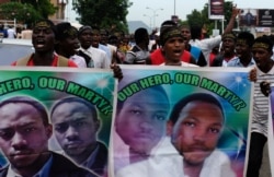 FILE - Members of the Islamic Movement of Nigeria chant slogans during a march to demand the release of their Nigerian Shi'ite leader Ibrahim Zakzaky, along a street in Abuja, Oct. 31, 2018.