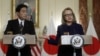 U.S. Secretary of State Hillary Clinton (R) holds a joint news conference with Japan's Foreign Minister Fumio Kishida after their meeting at the State Department in Washington, January 18, 2013.