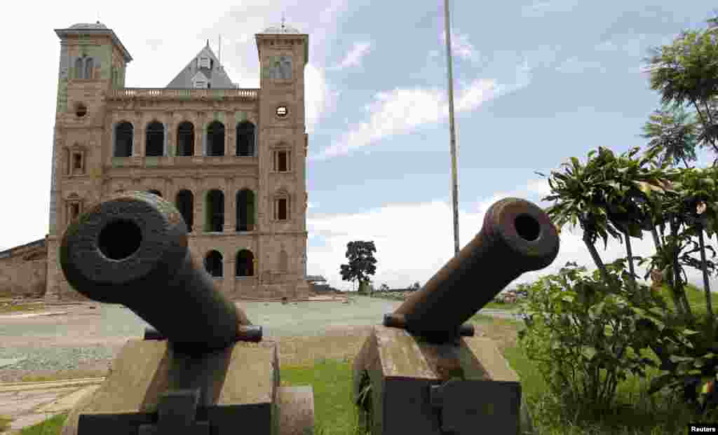 At the entrance of Madagascar&#39;s Queen Palace, also called ----Rova, stand old cannons. The landmark is located at the top of Analamanga hill and stands out in the skyline of the city. 