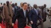 UN Secretary-General Ban Ki-moon, center, walks surrounded by Burundian Security personnel as he arrives in Bujumbura, Burundi, Monday, Feb.22, 2016.