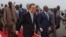 UN Secretary-General Ban Ki-moon, center, walks surrounded by Burundian Security personnel as he arrives in Bujumbura, Burundi, Monday, Feb.22, 2016.