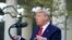 President Donald Trump speaks during the daily briefing on the novel coronavirus in the Rose Garden of the White House in Washington, March 30, 2020.