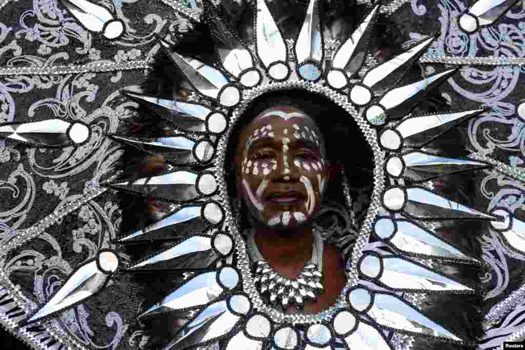 A woman wears a costume during J&#39;Ouvert, an overnight-into-dawn celebration ahead of the annual West Indian-American Carnival Day Parade in Brooklyn, New York.