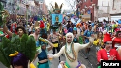 Revelers parade during a Mardi Gras celebration in New Orleans, Louisiana.