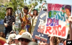 Fans outside the Capitol Records building in Hollywood celebrate Ringo Starr's 77th birthday during a gathering with an appearance by Starr, July 7, 2017, in Los Angeles.