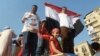 Thousands of supporters poured into Cairo's iconic Tahrir Square on Sunday, July 7, to cheer on what they are calling Egypt's "Second Revolution". Many brought their families and children to join in the celebration. VOA - S. Behn.