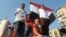 Thousands of supporters poured into Cairo's iconic Tahrir Square on Sunday, July 7, to cheer on what they are calling Egypt's "Second Revolution". Many brought their families and children to join in the celebration. VOA - S. Behn.
