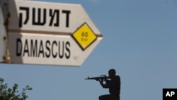 以色列与叙利亚交界处一个宣传路标（美联社）