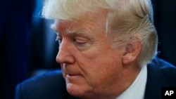 Le président Donald Trump au Bureau ovale de la Maison-Blanche, Washington, 24 mars 2017.