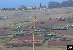 Zithulele Hospital looms in the distance in Oliver Tambo District, South Africa … Ndabazonke must walk very far over rough terrain, on crutches, to see her therapist at the facility