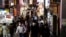 People wearing protective masks, amid the coronavirus disease (COVID-19) outbreak, make their way at a shopping district in Tokyo, Japan, July 28, 2021.