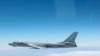 FILE - A Chinese military plane H-6 bomber flies through airspace between Okinawa prefecture's main island and the smaller Miyako island in southern Japan, photo taken Oct. 27, 2013.