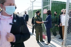 Vice President Kamala Harris talks to Gloria Chavez, Chief Patrol Agent of the El Paso Sector, as she tours the U.S. Customs and Border Protection Central Processing Center, June 25, 2021, in El Paso, Texas.
