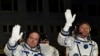 U.S. astronaut Scott Kelly, left, and Russian cosmonaut Gennady Padalka, crew members of the mission to the International Space Station, ISS, wave prior to the launch of Soyuz-FG rocket at the Russian-leased Baikonur cosmodrome, Kazakhstan, March 27, 201