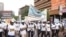 Government officials participate in the anti-corruption walk in Kampala, Uganda, Dec. 4, 2019. (Halima Athumani/VOA News)