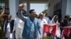 Parliamentarians of the Pakistan Tehreek-e-Insaf party carry posters of jailed former Prime Minister Imran Khan, during a protest outside the Parliament house in Islamabad on July 18, 2024. The party on July 20 said several members were "abducted."