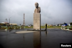 FILE – A statue of Soviet state founder Vladimir Lenin towers in Yuzhno-Kurilsk, the main settlement on what Russians call the southern Kuril island of Kunashir.