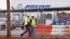 Workers walk through the Boeing South Carolina Plant while voting started on Wednesday whether the plant will be unionized in North Charleston, South Carolina, Feb. 15, 2017. 