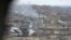 Mosul's Old City, seen through a sniper hole on the outskirts, is the scene of some of the fiercest fighting since operations to retake the city from IS militants began in October, March 25, 2017.