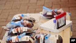 FILE - Bags of donated blood are seen at a blood-donation drive in City Square, Kampala, Uganda, Sept. 19, 2020. In Cameroon, hospitals are facing a shortage of donated blood.