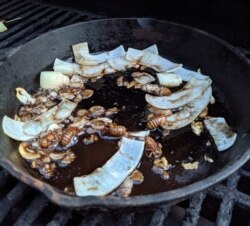 Brian Schwatken in Arlington, Virginia, fries cicadas with butter, garlic and onions. 'They are tender and have a nutty taste,' he said. (Courtesy Brian Schwatken)