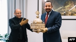 የኢትዮጵያ ጠቅላይ ሚኒስትር ዐቢይ አህመድ እና አቶ ሲራክ አስፋው 