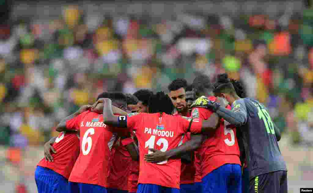 Gambia players huddle before the start of the second half in the game against host country Cameroon, Jan. 29, 2022.