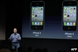 Apple's Phil Schiller talks about the iPhone 4S world phone during an announcement at Apple headquarters in Cupertino, Calif., Tuesday, Oct. 4, 2011. (AP Photo/Paul Sakuma)