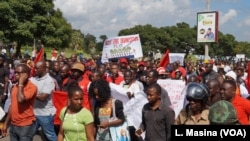 Protesters march along Kamuzu Highway in Blantyre, Malawi, April 27, 2018. 