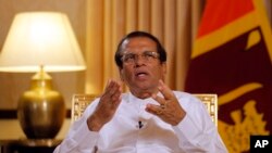 FILE - Sri Lankan President Maithripala Sirisena speaks during an interview with the Associated Press at his residence in Colombo, May 7, 2019.