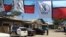 Political signs and flags around Dar es Salaam promoting Tanzanian opposition party Chadema in preparation for elections Sunday. Oct. 23, 2015. (Photo: Jill Craig/ VOA)