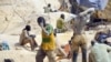 Des creuseurs dans une mine d'or clandestine dans le village de Nobsin, dans la région de Ganzourgou, Burkina Faso, 20 février 2014.