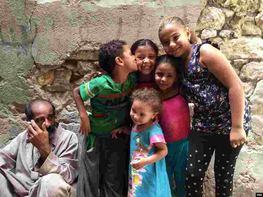 Mostafa is the ailing grandfather of five children who visit him every Friday. When he is with the children he says, "I feel like a kid. I feel powerful. I can run like my grandsons.” 3 June 2016. (Photo: Hamada Elrasam for VOA) 