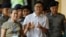 Detained Reuters journalist Wa Lone walks with his wife Pen ei mon as he arrives at Insein court in Yangon, Myanmar, July 23, 2018.