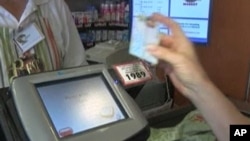 Food stamp recipient pays for groceries in New York