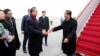 Chinese State Councilor and Foreign Minister Wang Yi welcomes Cambodian Prime Minister Hun Sen as he arrives at the Beijing Capital International Airport in Beijing, China February 5, 2020. 