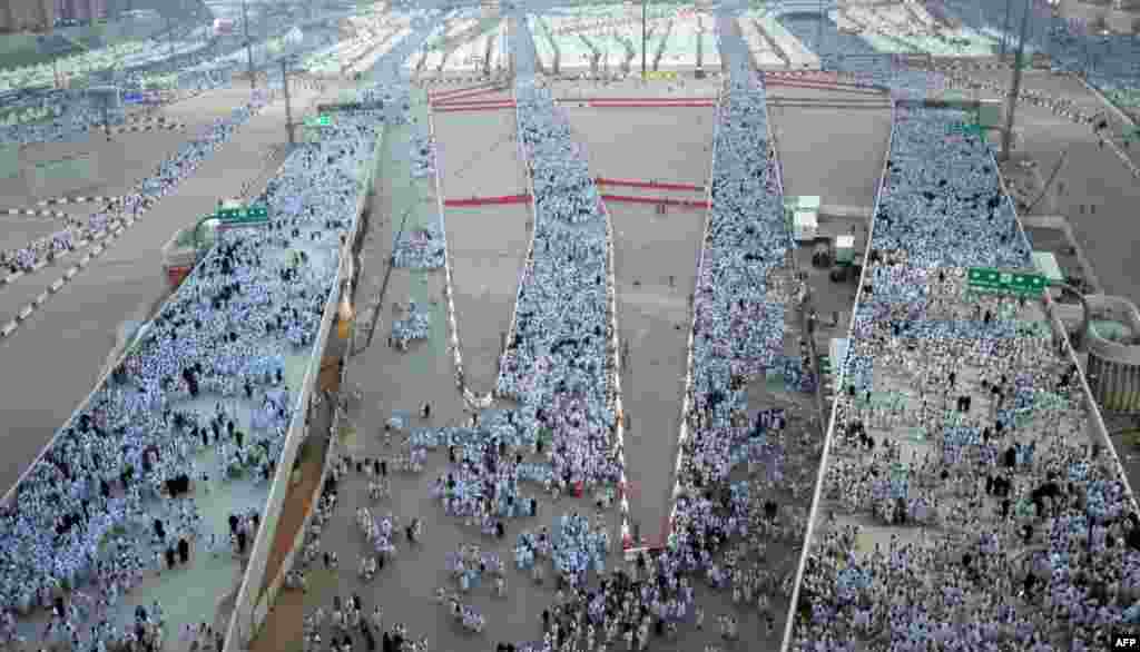 Muslim pilgrims arrive to throw pebbles at pillars during the "Jamarat" ritual, the stoning of Satan, in Mina near the holy city of Mecca, Saudi Arabia. 