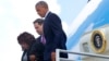 President Barack Obama, with Rep. Corrine Brown, D-Fla., left, and Sen. Marco Rubio, R-Fla.,center, get off Air Force One upon their arrival at Orlando International Airport, June 16, 2016, in Orlando, Fla. 