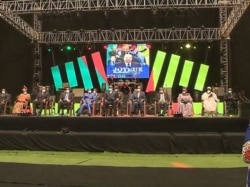 Government ministers join young people at Biya's 88 birthday celebration, in Yaounde, Feb. 13, 2021. (Moki Edwin Kindzeka/VOA)